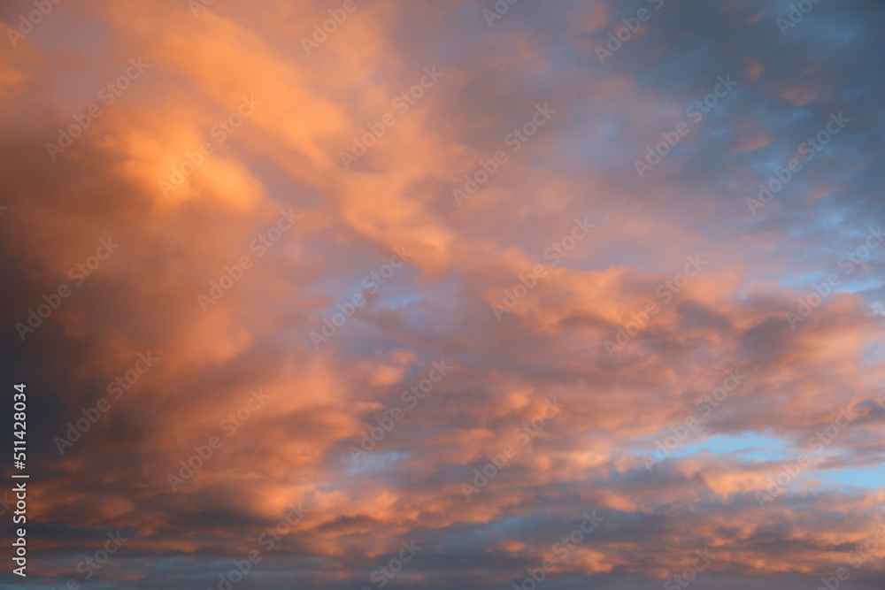 blue sky and many clouds with orange and pink colors