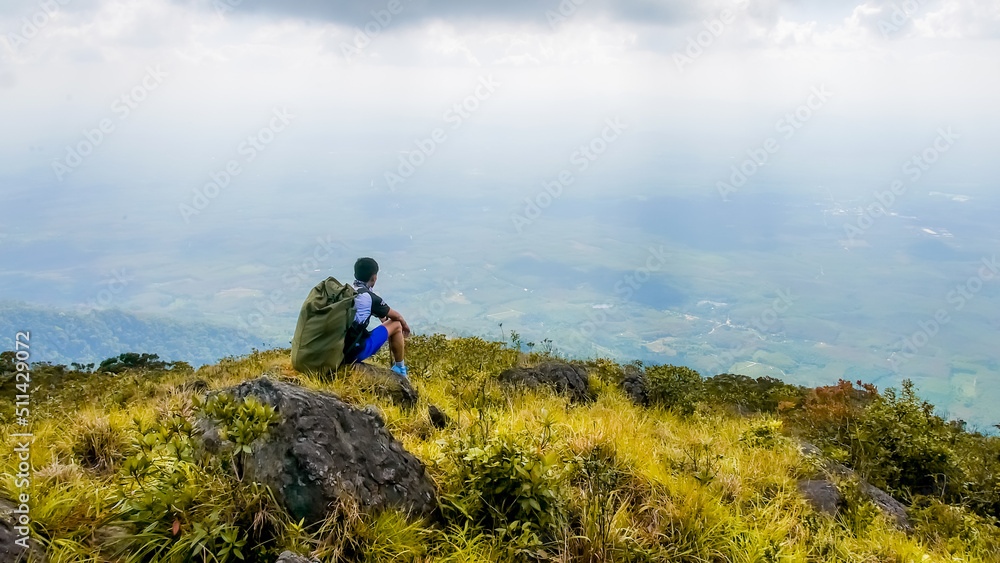 Tourists looking at the beautiful scenery on the high mountains in Thailand. trekking tourism concept