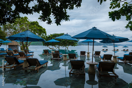 Aerial view of Naka Island near Phuket Thailand, a tropical Island in Thailand with beach chairs in the pool.  photo