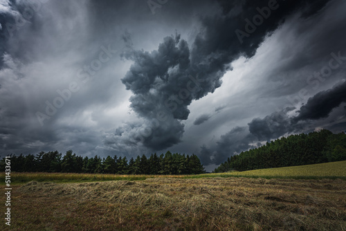 Dramatic thunderclouds and storm clouds in summer. © CreativeImage