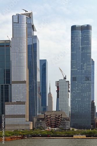 Hudson Yards, neighborhood on West Side of Midtown Manhattan, with skyscrapers and Vessel, structure and visitor attraction. View from water