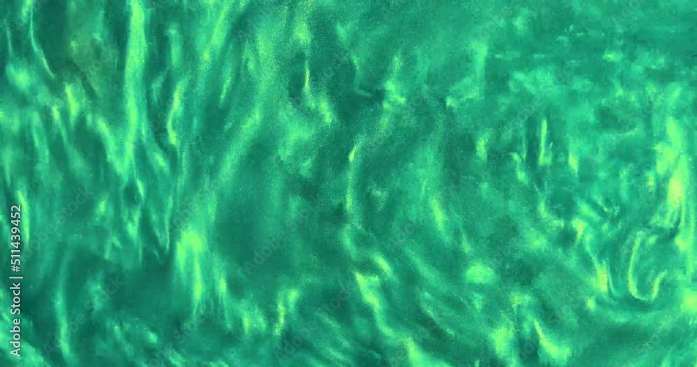 green abstract background of swirling dense fluid. view from above green abstract background of swirling dense fluid. view from above