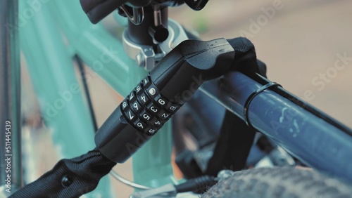 Bike Secured to Outdoor Stand with Combination Lock	
 photo