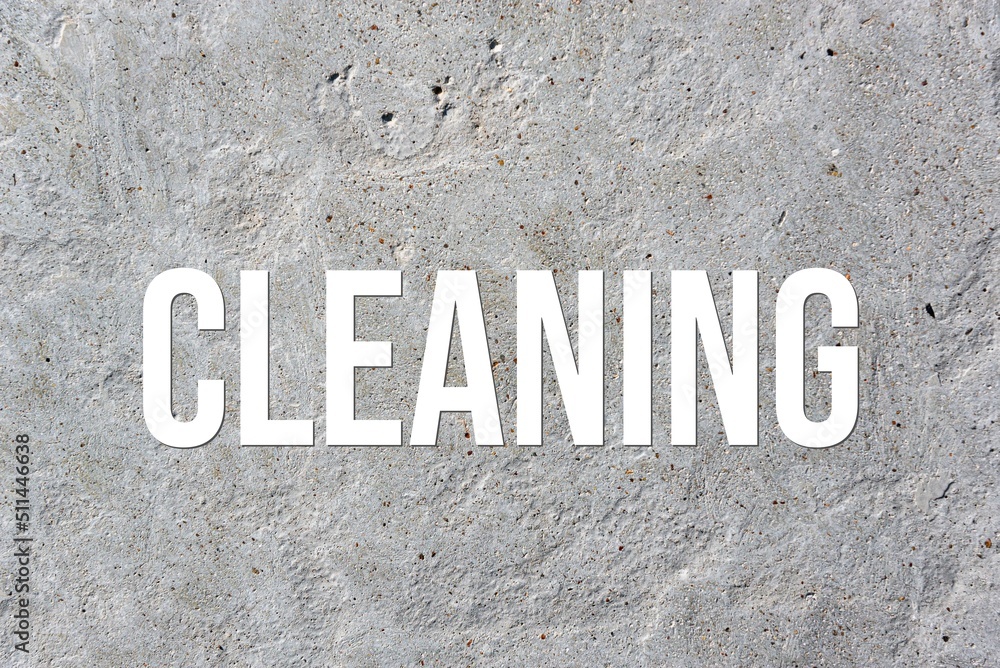 CLEANING - word on concrete background. Cement floor, wall. CLEANING - word on concrete background. Cement floor, wall.