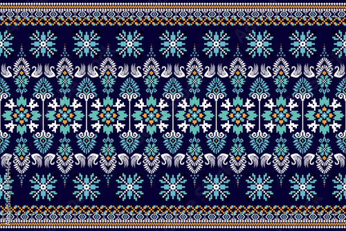 Beautiful Ukrainian knitted embroidery.geometric ethnic oriental pattern traditional on blue background.Aztec style,abstract,vector,illustration.design for texture,fabric,clothing,wrapping,carpet. photo
