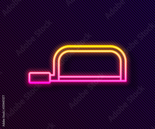 Glowing neon line Hacksaw icon isolated on black background. Metal saw for wood and metal. Vector