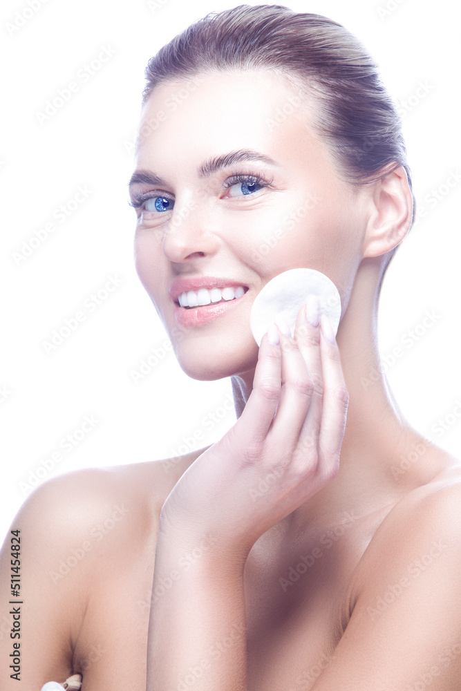 Beauty Portrait of Winsome Young Girl with Fresh Clean Skin Applying Cotton Cleaning Pads For Facial Cleaning Posing Against Pure White. Beauty Portrait of Winsome Young Girl with Fresh Clean Skin Applying Cotton Cleaning Pads For Facial Cleaning Posing Against Pure White.