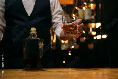 Barman pouring whiskey whiskey glass beautiful night