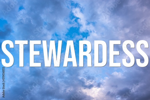 STEWARDESS - word on the background of the sky with clouds.
