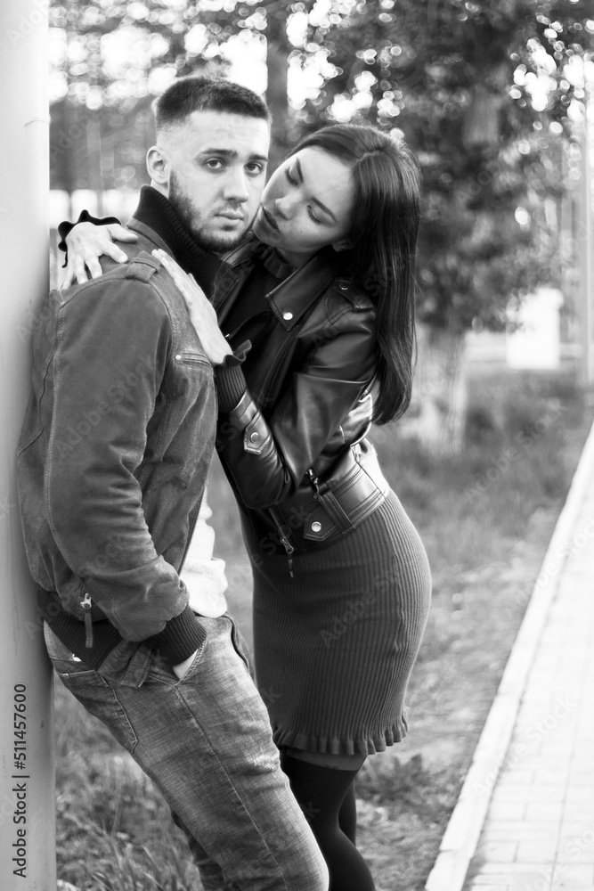 Couple in love on romantic dating, sensual relationship and desire of lovers, young man and woman having fun together outdoors, happy family life and candid lifestyle, vertical black white image Couple in love on romantic dating, sensual relationship and desire of lovers, young man and woman having fun together outdoors, happy family life and candid lifestyle, vertical black white image