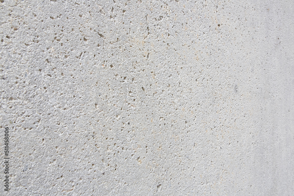 New exposed concrete wall with holes left by the evaporation of the mixing water New exposed concrete wall with holes left by the evaporation of the mixing water