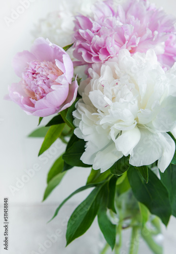Beautiful bouquet of flowers: white and pink peonies.