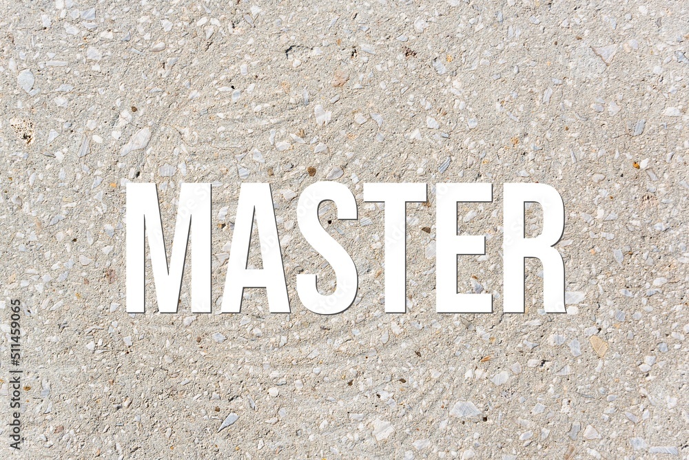 MASTER - word on concrete background. Cement floor, wall. MASTER - word on concrete background. Cement floor, wall.