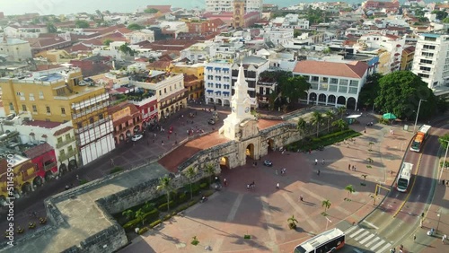Cartagena, Colombia: Aerial drone footage with a tilt down motion of the Torre del Reloj and city wall in Cartagena colonial old town and the Plaza de los coches in Colombia, South America photo
