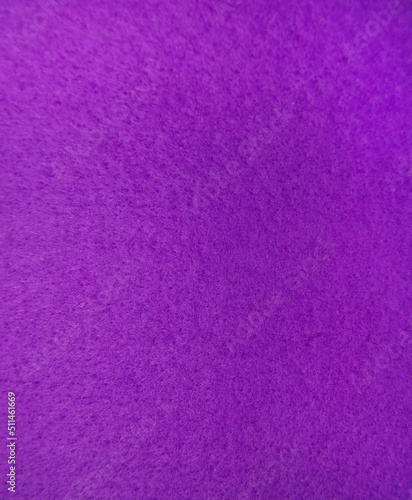 Purple felt fabric close-up. Abstract background. The texture of the fibers. Velvet surface.