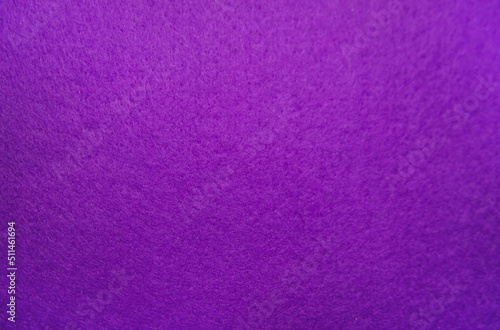 Purple felt fabric close-up. Abstract background. The texture of the fibers. Velvet surface.