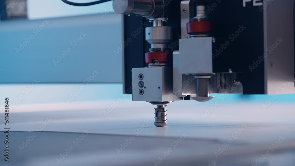 Close-up, cutting machine cuts paper in a printing house. Close-up, cutting machine cuts paper in a printing house.