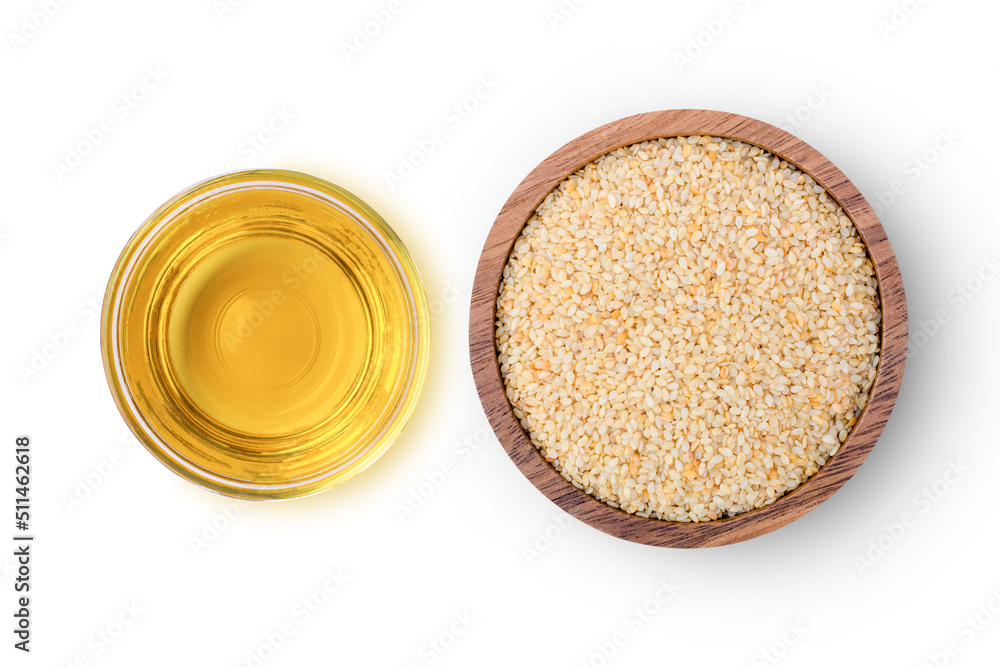 Sesame seed oil with white sesame seeds in bowl isolated on white background. Top view. Flat lay. Sesame seed oil with white sesame seeds in bowl isolated on white background. Top view. Flat lay.