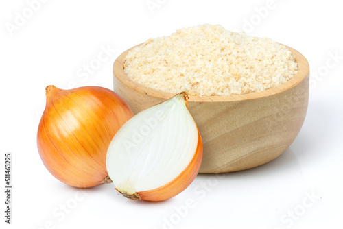 Ground onion or onion powder in wooden bowl and fresh onion with half sliced isolated on white background.