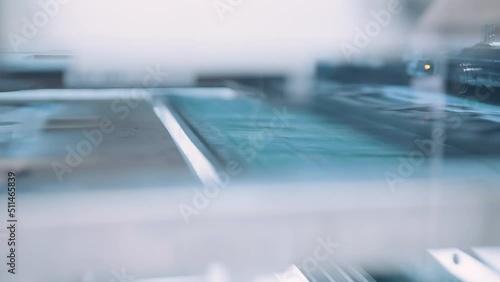 Close up, Automatic line for printing and cutting in the printing house.