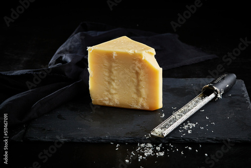 Parmesan cheese block on black slate