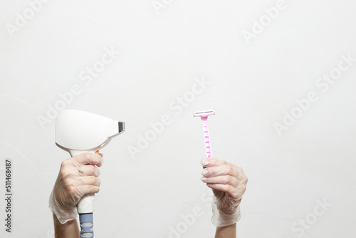 razor and diode laser in hands. laser hair removal