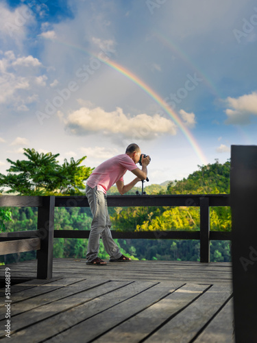 A photographer is shooting beautiful view after rained.