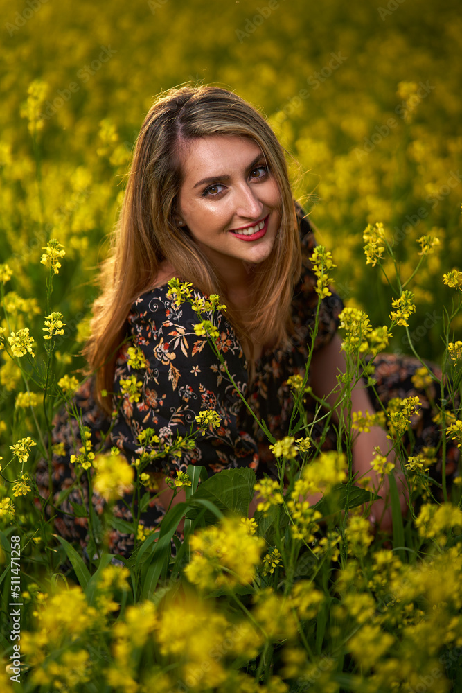 Plus size indian woman in a field at sunset Plus size indian woman in a field at sunset