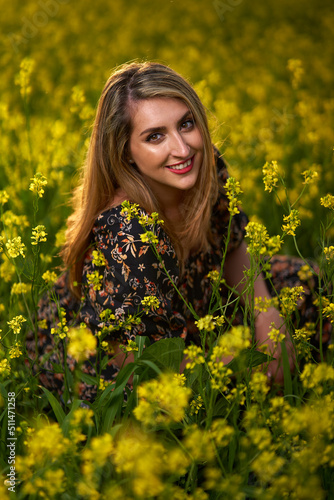 Plus size indian woman in a field at sunset