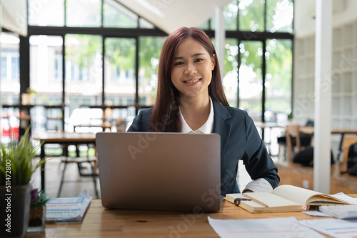Free Download Portrait Young asian businesswoman working at her office. looking on camera concept. - GFXLoad