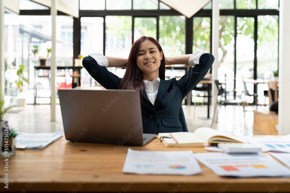 Young asian business woman having break and resting after solving task at modern office. Young asian business woman having break and resting after solving task at modern office.