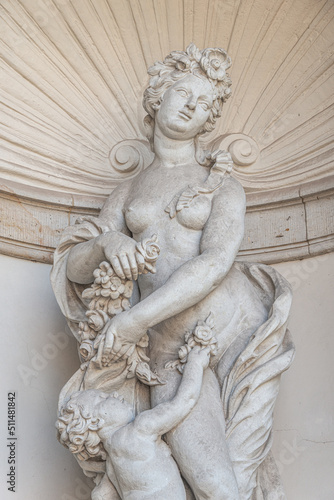 Old sculpture of a sensual woman nymph bathing at the fountain in Zwinger gardens at historical and museums downtown of Dresden, Germany. © neurobite