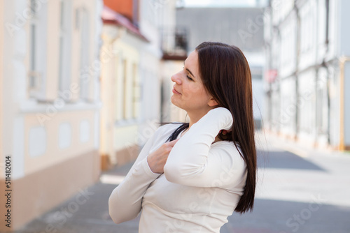Happy young woman in a dress on a walk in the city Free Download Happy young woman in a dress on a walk in the city - GFXLoad