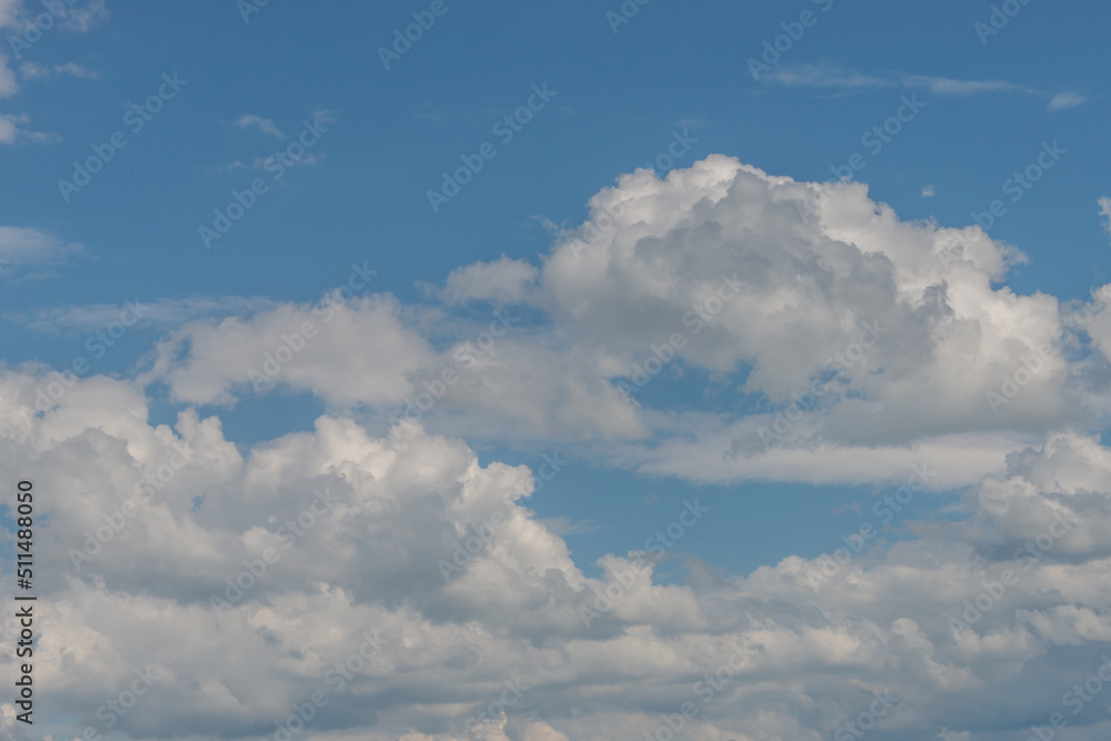 Cover page with soft blue sky with illuminated clouds as a background. Cover page with soft blue sky with illuminated clouds as a background.
