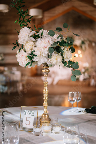 Beautiful groom and bride table decorated with natural materials and a lot of flowers