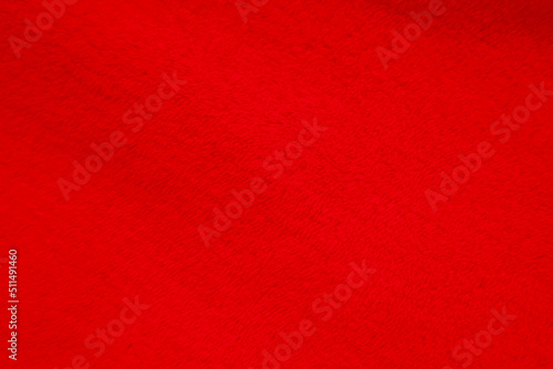 Red clean wool texture background. light natural sheep wool. red seamless cotton. texture of fluffy fur for designers. close-up fragment red wool carpet...