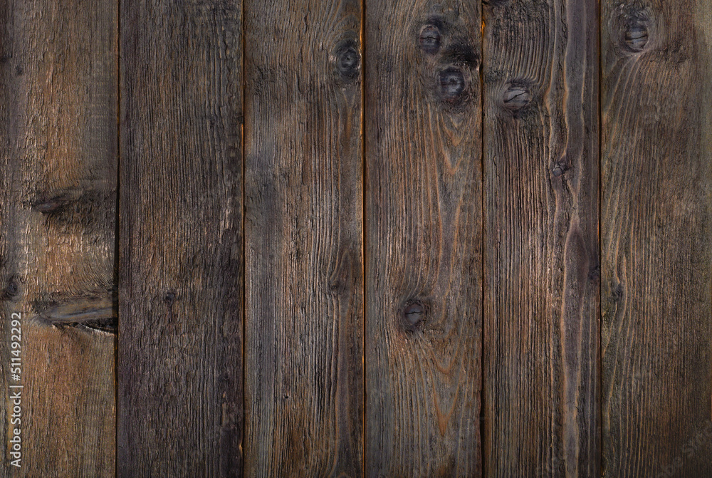 old burnt boards. Wooden dark brown background texture. old burnt boards. Wooden dark brown background texture.