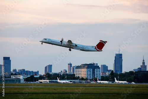 Bilde på lerret The big passenger plane takes off at the city airport.