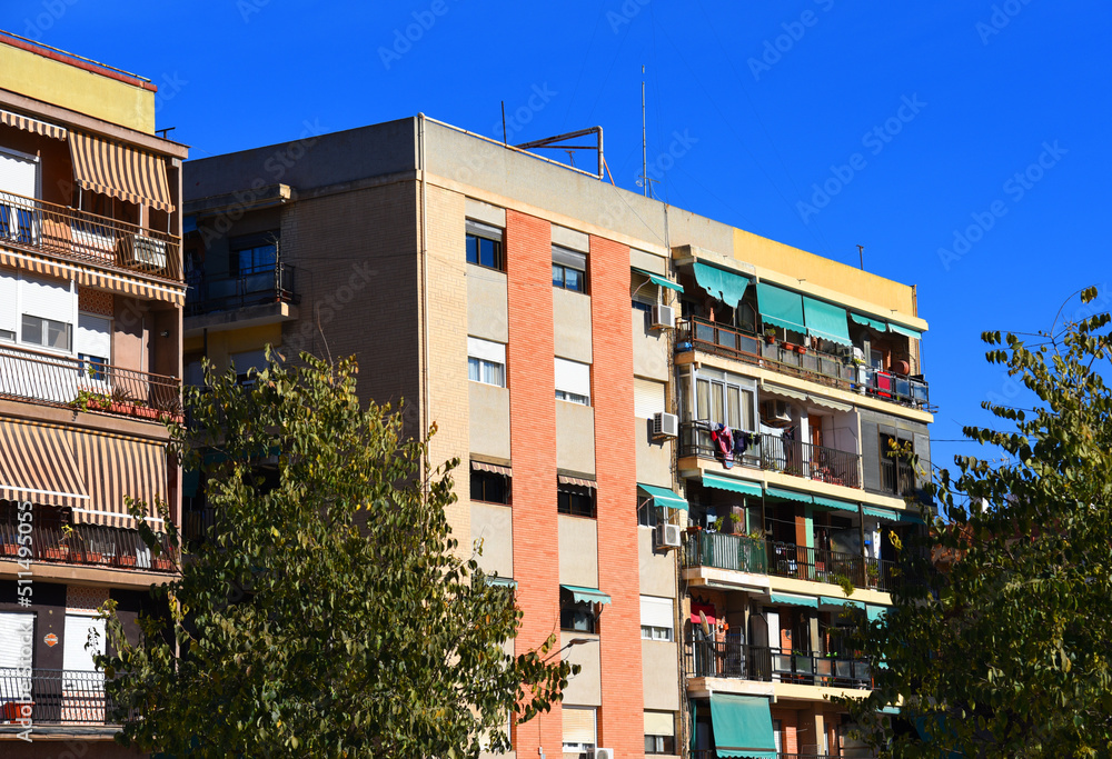 Facade of a building. Residential building with balconies and windows. Colorful buildings apartments. House with window and balcony. Buildings architecture in Europe..