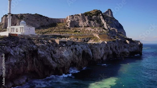 Waves Crashing Into Rocky Foreshore Of Europa Point With Ibrahim-al-Ibrahim Mosque In Gibraltar. Aerial Approach