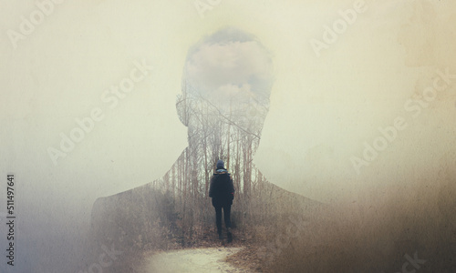 The soul seeks its own path. Composite image of a mans silhouette superimposed on a woman alone in the woods.