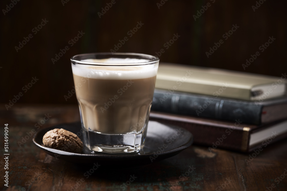 Coffee with milk on dark wooden background. Soft focus. Copy space. Coffee with milk on dark wooden background. Soft focus. Copy space.