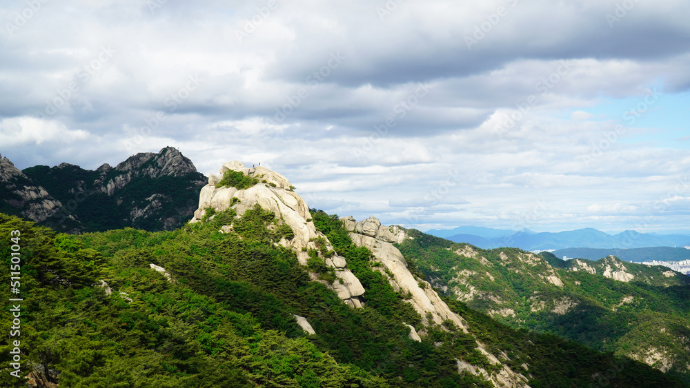 The grandeur of the mountain peaks and clouds of Bukhansan Mountain