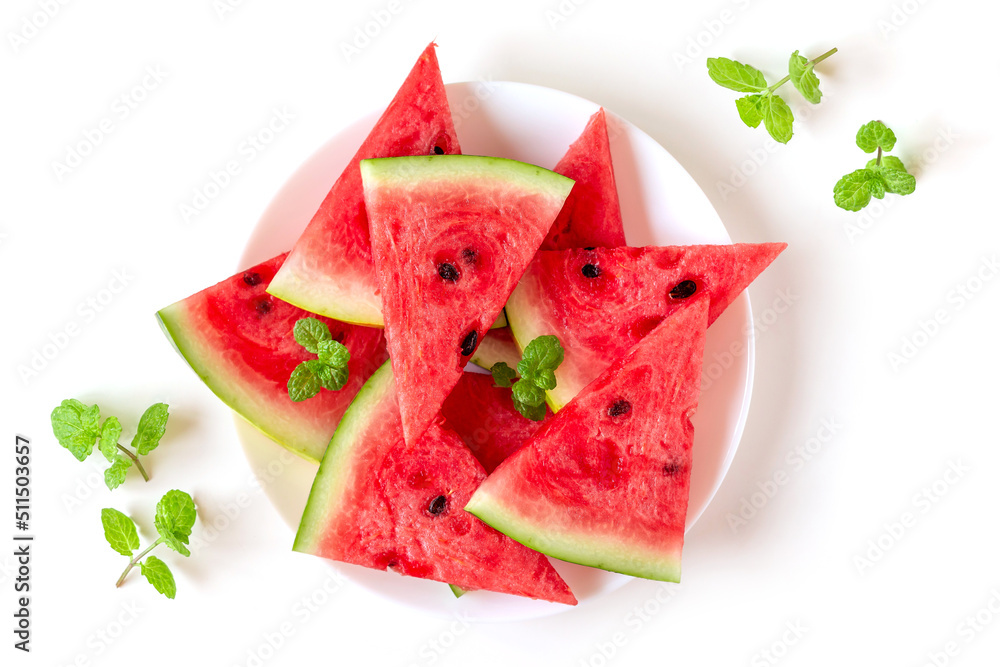 Juicy fresh nutritious watermelon on a plate with mint leaves on the side, healthy eating habit Juicy fresh nutritious watermelon on a plate with mint leaves on the side, healthy eating habit