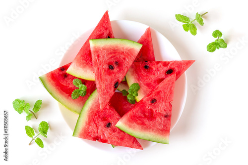 Juicy fresh nutritious watermelon on a plate with mint leaves on the side, healthy eating habit