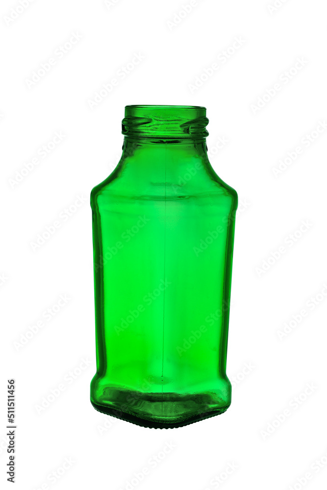 Empty bottle with a wide neck of a square shape made of transparent, green glass. Isolated on a white background, close-up Empty bottle with a wide neck of a square shape made of transparent, green glass. Isolated on a white background, close-up