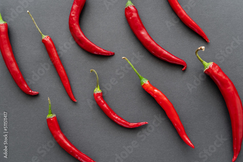 Top view of chili peppers on black background.