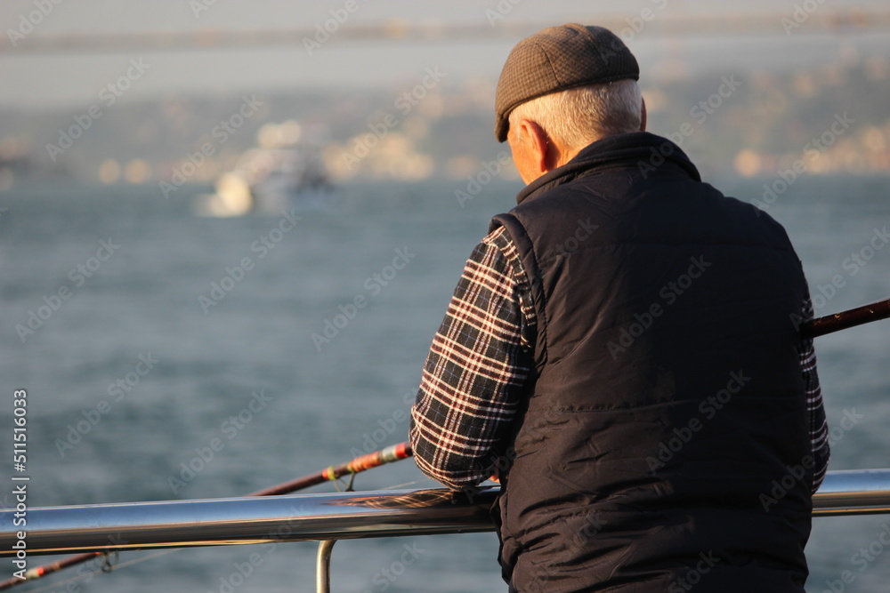 old man fishing in istanbul bosphorus