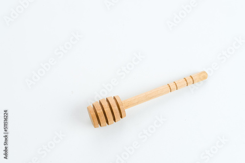 Honey dipper or spoon for honey, isolated on white background, copy space. 