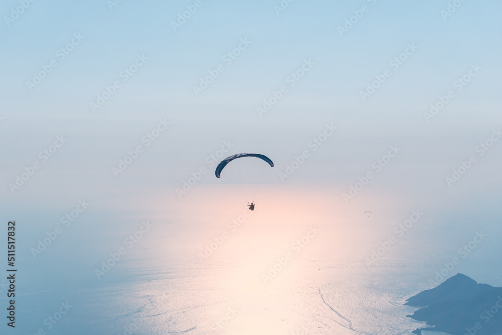 Paraglider flying on Oludeniz beach in Fethiye, Mugla,. Travel destination. Summer and holiday concept. Paraglider flying on Oludeniz beach in Fethiye, Mugla,. Travel destination. Summer and holiday concept.